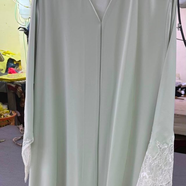 Sage abaya with lace cuffs and hem