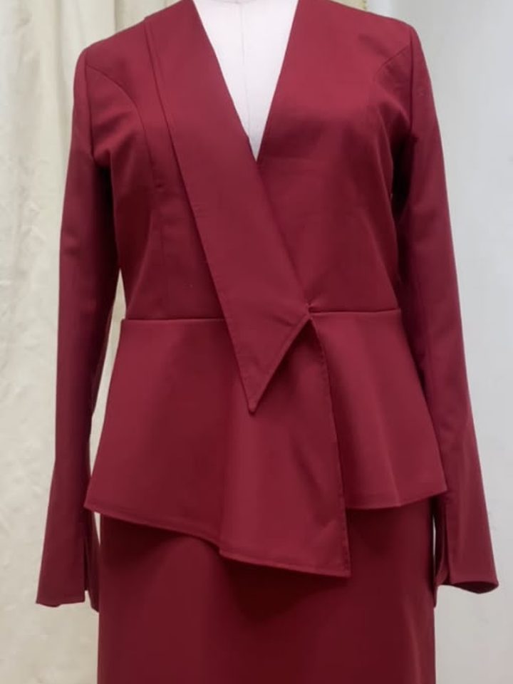 Burgundy peplum top with a matching skirt